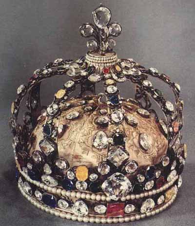 The coronation crown of Louis XV. It was originally set with the Regent and Sancy Diamonds, the Sancy being the larger stone at the top of the crown in the fleur-de-lis. The Regent is in the circlet on the front of the crown.