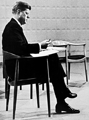 John F. Kennedy seated in The Chair at the 1961 presidential debate.