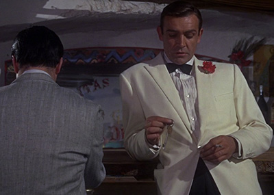 Sean Connery wearing James Bonds first ivory dinner jacket in 'Goldfinger'.