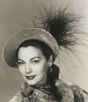 Ava Gardner wearing a hat by Walter Florell.