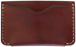 Makr Two exterior card pockets with center partition. Handsewn with burnished edges card holder: US$180.