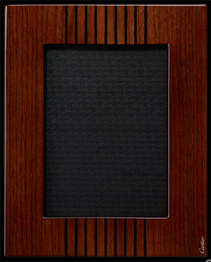 Cartier Transatlantique photo frame in walnut wood. Dimensions: 26 cm wide x 21 cm long.