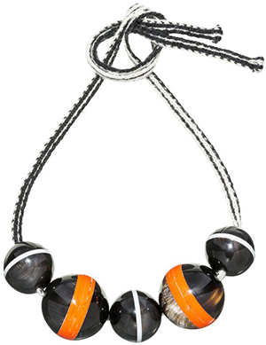 Marni women's necklace with spheres in horn threaded onto a wool ribbon: US$1,020.