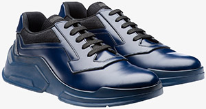 Prada Brushed calf leather men's sneaker with technical fabric inserts.