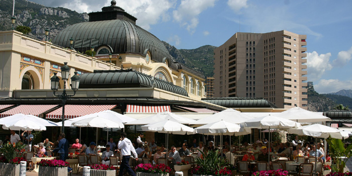 Café de Paris at Place du Casino with luxury apartment building Le Mirabeau in the background.