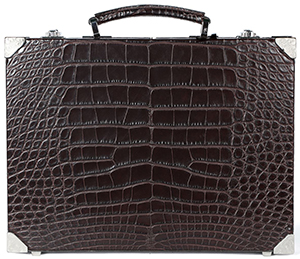 Brioni Ultra-thin Hard Case in crocodile with metal details and inner lining in grosgrain: €22,000.