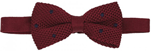Claret knitted silk bow tie with navy-blue dots: €65.