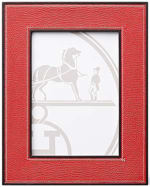 Hermès leather picture frame in vermillion red goatskin with solid rosewood: US$930.