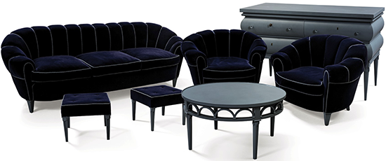 Bruno Paul: Salon, circa 1930. Composed of a expressionist blue sofa, two armchairs, two stools, a circular coffee table and a chest of four drawers.