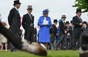 Britain's Queen Elizabeth II, center, and Prince Philip, second from left, view the horses from the parade ring before the Diamond Jubilee Coronation Cup race at Epsom Derby, Epsom, England, on June 2, 2012.