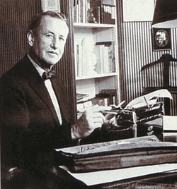 Ian Fleming with his gold-plated Royal Quiet Deluxe Portable Typewriter.