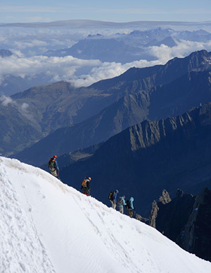 Climbers descending the ridge of Aiguille du Midi (France).