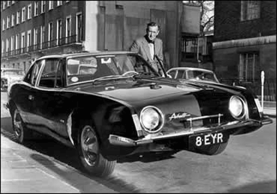 James Bond author Ian Fleming with his black 1963 Studebaker Avanti, designed by Raymond Loewy.