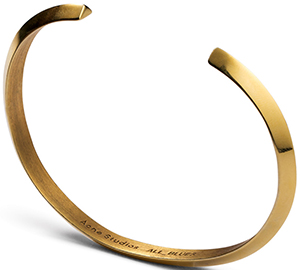 Acne Studios Brace is a gold plated silver bracelet: US$560.