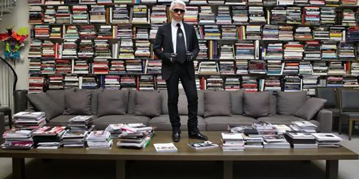 Karl Lagerfeld posing in his Parisian bookstore: 7L, 7 Rue de Lille, 75007 Paris, France.