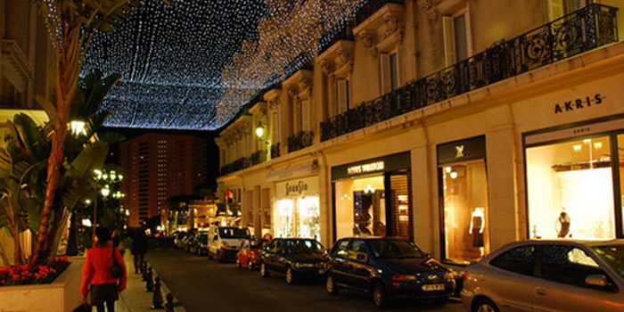 Shopping in Monaco: the 'Carré d'Or' boutiques - the Place du Casino and the neighbouring roads (Avenue Monte-Carlo, Avenue des Beaux Arts, Allées Lumières) with luxury apartment building Le Mirabeau in the background.