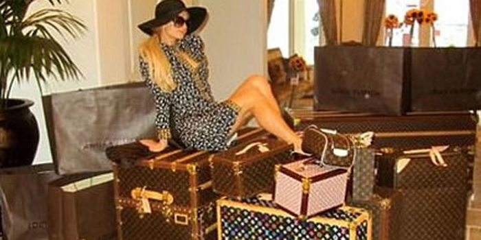 Paris Hilton with her Louis Vuitton luggage.