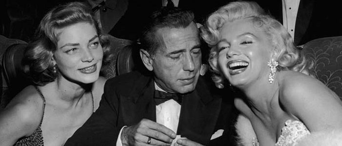 Humphrey Bogart with Marilyn Monroe and Lauren Bacall.