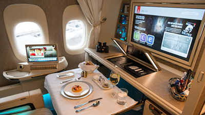 On Emirates, high-wall first-class suites offer privacy for dining, sleeping, working and entertainment..