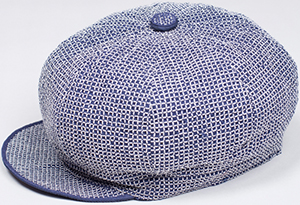 Jupe by Jackie Boxed Hat created with white and navy cotton yarn, hand embroidered into lines on fine ribbed silk: €425.